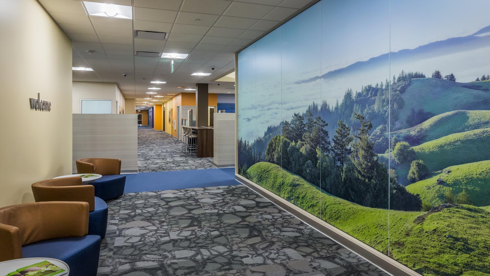 Large graphic walls of natural landscapes bring the outdoors in