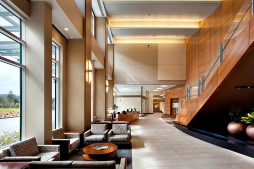 Entry lobby with warm wood, hospitality feel